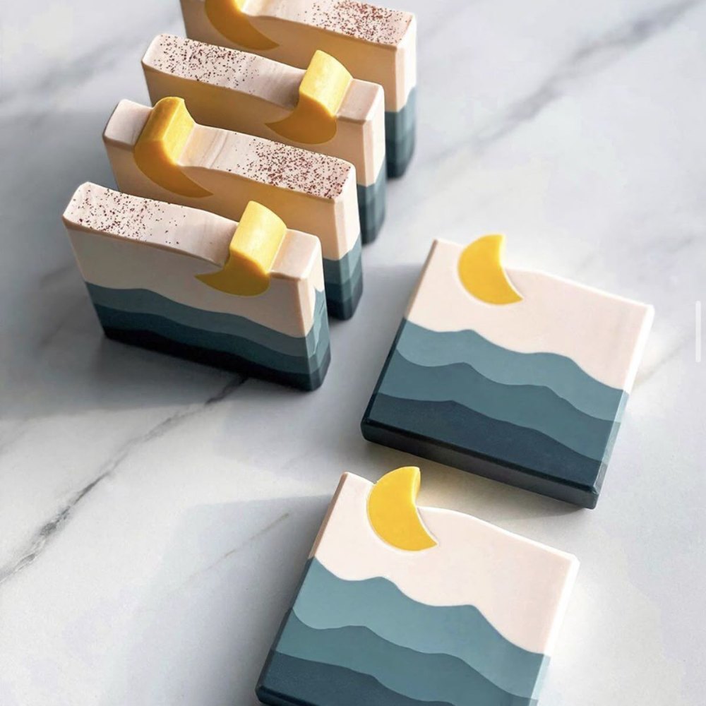 Charcoal and peppermint bars with a dark base and pale swirl