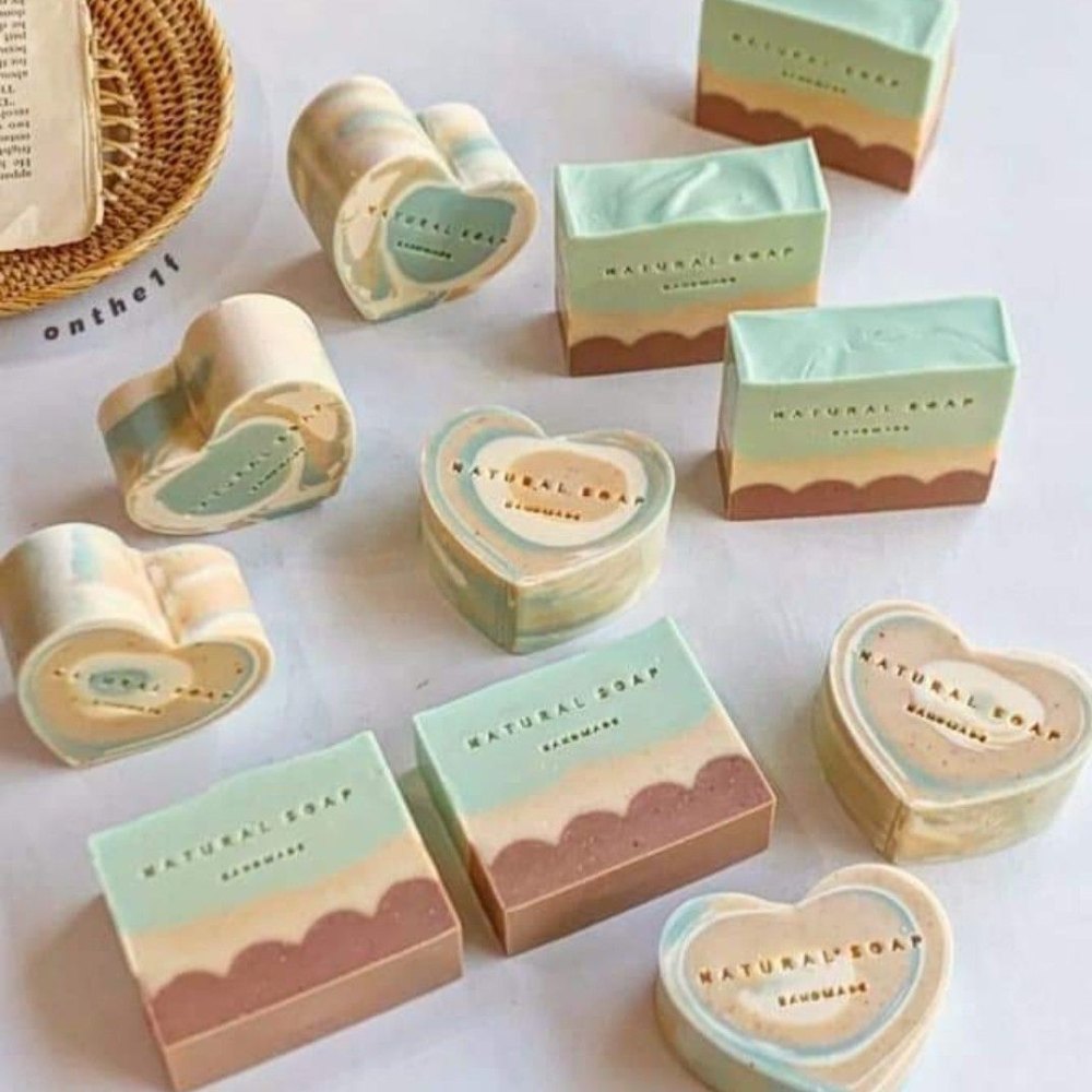 Soft pastel unscented oat soap bars laid out in a row