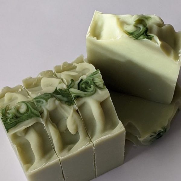 Rose geranium and shea butter bars with piped rose tops