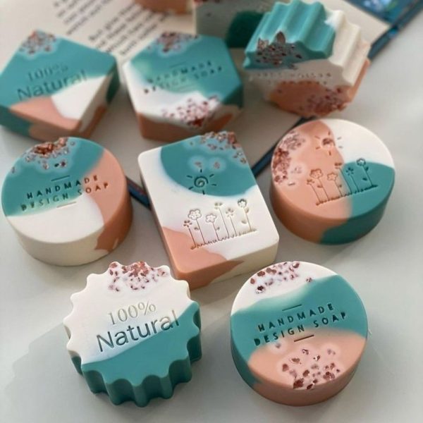 Wild rose clay bars in blush pink and cream with dried petals